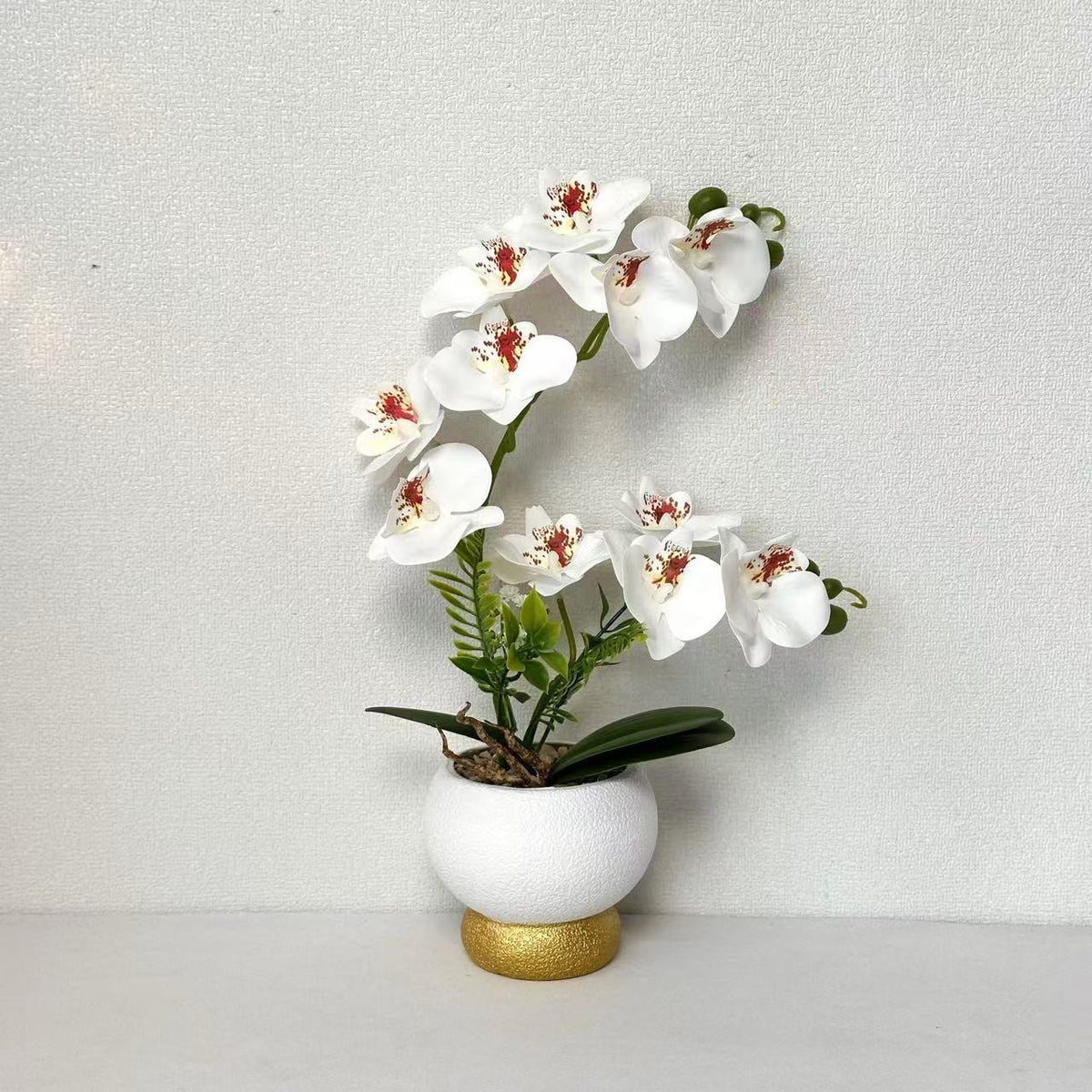 Künstliche Orchideenarrangement für Tischdekoration