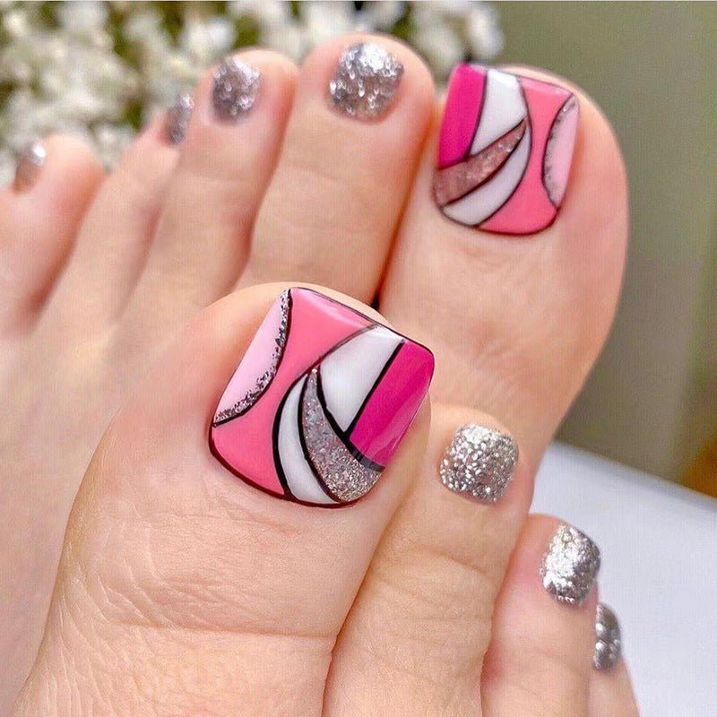 Kunstvolle Fußnagelkunst mit bunten geometrischen Designs Brehn