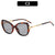 Elegante Katzenaugen-Sonnenbrille mit dekorativen goldenen Akzenten