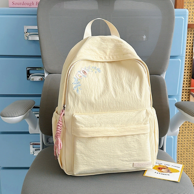 Blumenbestickter Schulrucksack