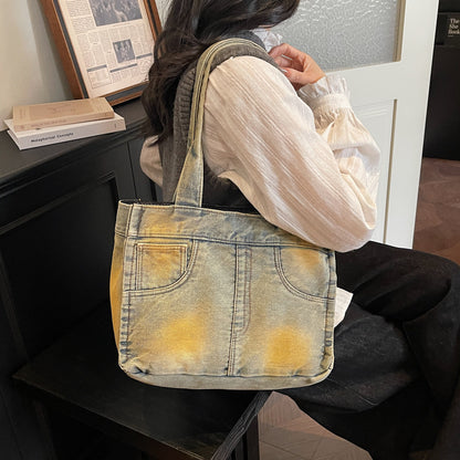 Denim-inspirierte Mehrfach-Taschen Tote Bag