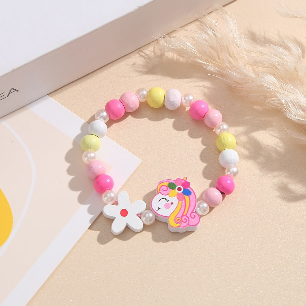 Verspieltes Kinderarmband mit Einhorn- und Blumenmotiv Brehn