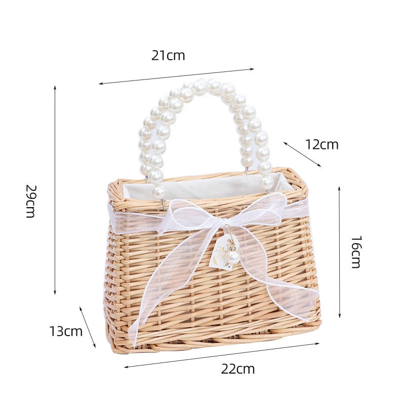 Damen Handtasche aus geflochtenem Material mit eleganten Perlengriffen Brehn
