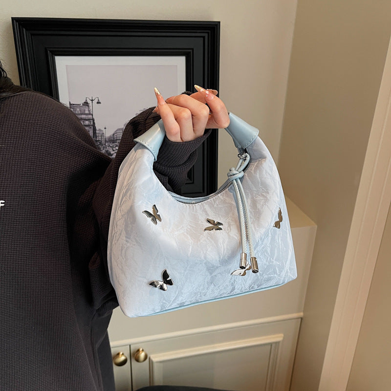 Stylische Handtasche mit Schmetterlingsdetail Brehn
