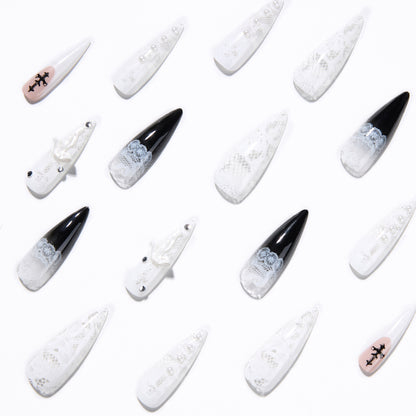 Kunstvolle Stiletto-Nägel mit einzigartigen 3D-Elementen und Glitzerakzenten Brehn