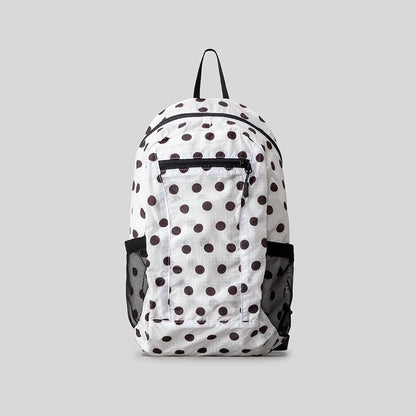 Verspielt gepunkteter Rucksack