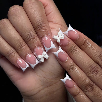 Elegante Stiletto-Nagelkunstverlängerungen mit Schleifenakzenten Brehn