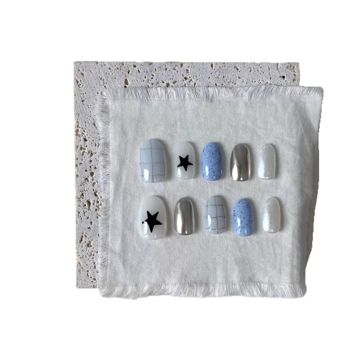 Künstlerisches Press-On-Nagelset mit geometrischen und Sternmustern