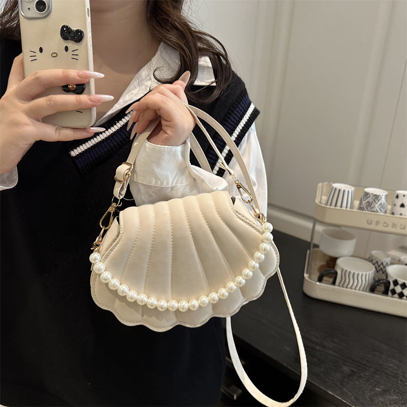 Elegante muschelförmige Umhängetasche Brehn
