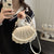 Elegante muschelförmige Umhängetasche Brehn