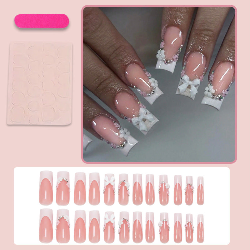 Kunstnagelset mit eleganten Schleifen und Glitzerakzenten Brehn