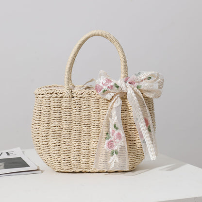 Elegante Basttasche mit Floralem Schleifendetail Brehn