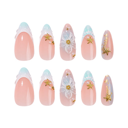 Kunstvolle Stiletto-Nägel mit floralen und glamourösen Akzenten Brehn