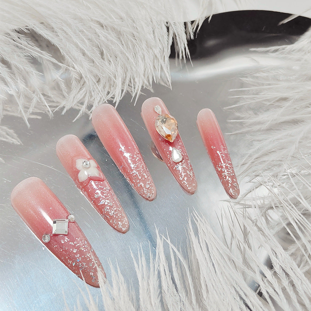 Glänzende Kunstnägel mit Strass und Glitter Brehn