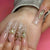 Kunstvolle Long Nails mit eleganten Goldakzenten Brehn