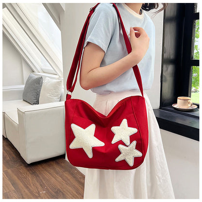Lässige mit Sternen verzierte Schultertasche