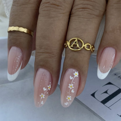 Kunstvolle Nagelverlängerungen mit zarten Blumenmustern Brehn
