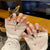 Dekoratives thematisches Acryldesign Press-On Nagelset Brehn
