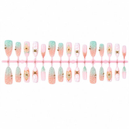 Kunstnagelset mit floralen und glamourösen Designs Brehn