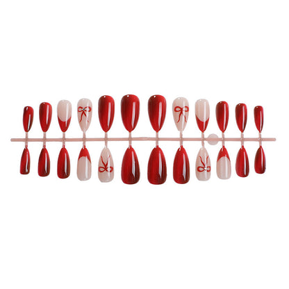 Glamouröses Kunstnagelset mit Glitzer-Effekten und eleganten Bogenmotiven Brehn