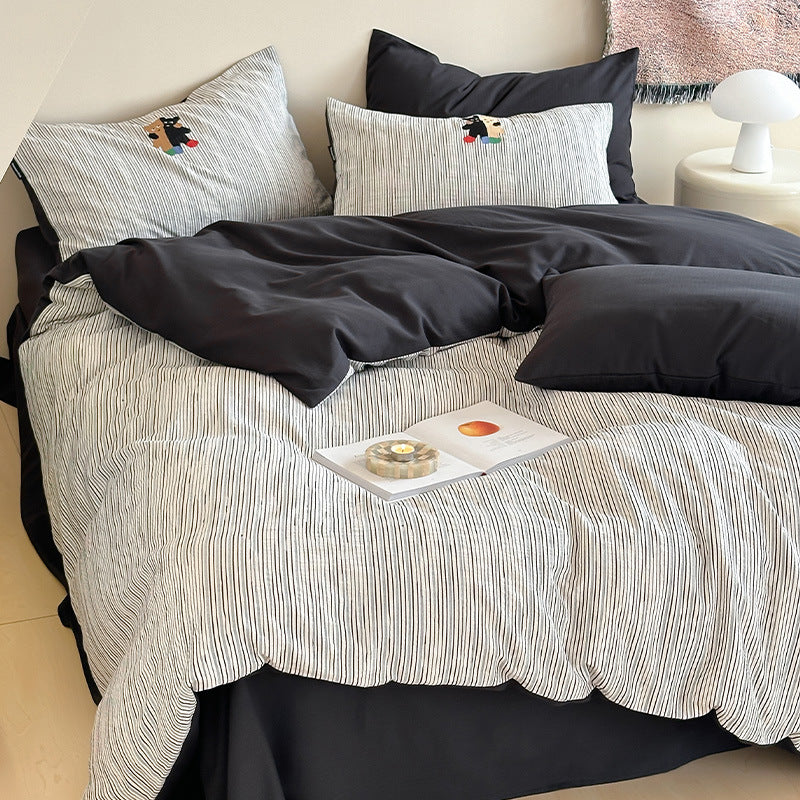 Wendbares strukturiertes Baumwoll-Satin-Bettbezug-Set mit dezenten gestickten Motiven und Kissenbezügen