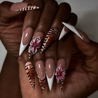 Kunstvolle Stiletto-Nägel mit floralem und tierischem Design Brehn