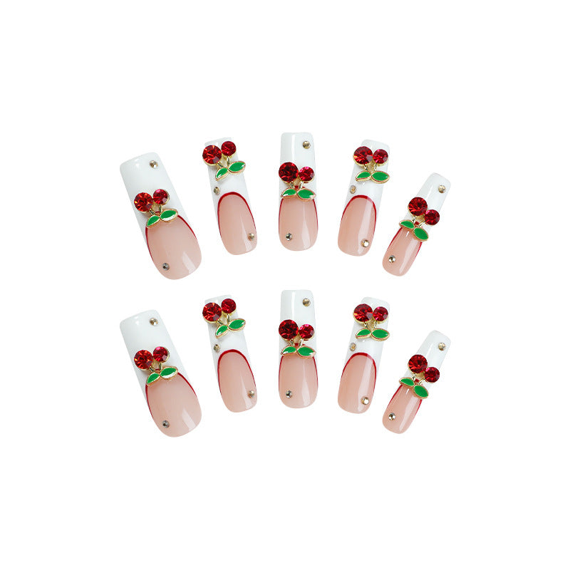 Kunstnagelset mit Kirschmotiv und funkelnden Strasssteinen Brehn