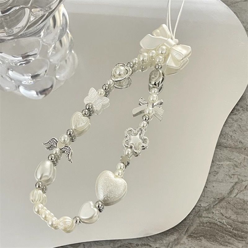 Herz und Schmetterling Charm Perlenarmband Brehn