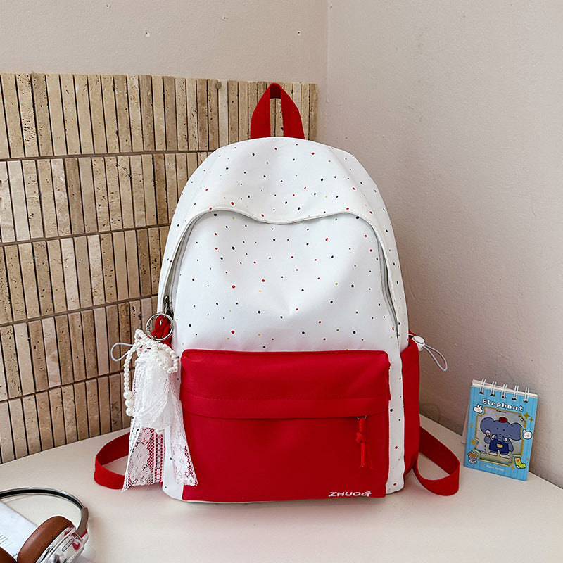 Lustiger gepunkteter Schulrucksack