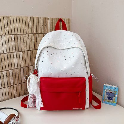 Lustiger gepunkteter Schulrucksack