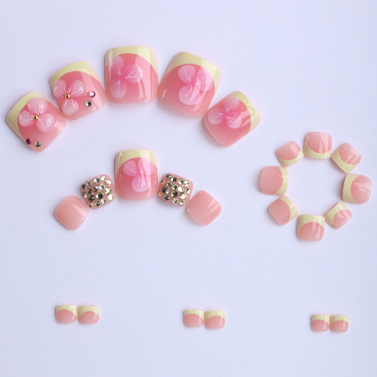 Künstliche Nagelverlängerungen mit Blüten-Design und Glitzerakzenten Brehn