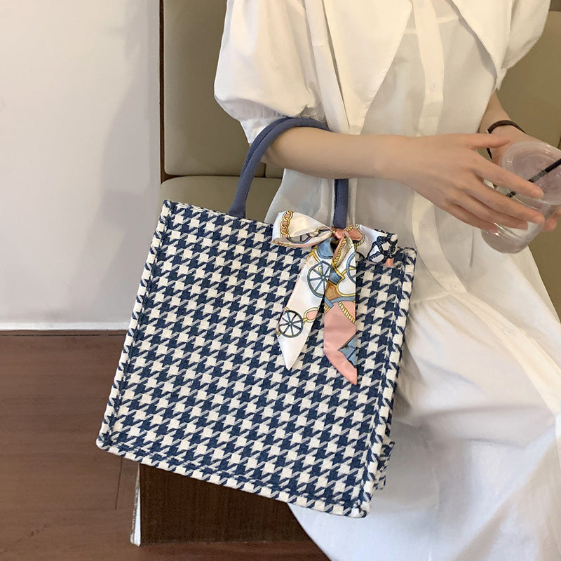 Elegante Houndstooth-Handtasche mit dekorativem Schleife