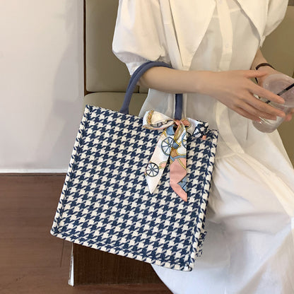 Elegante Houndstooth-Handtasche mit dekorativem Schleife