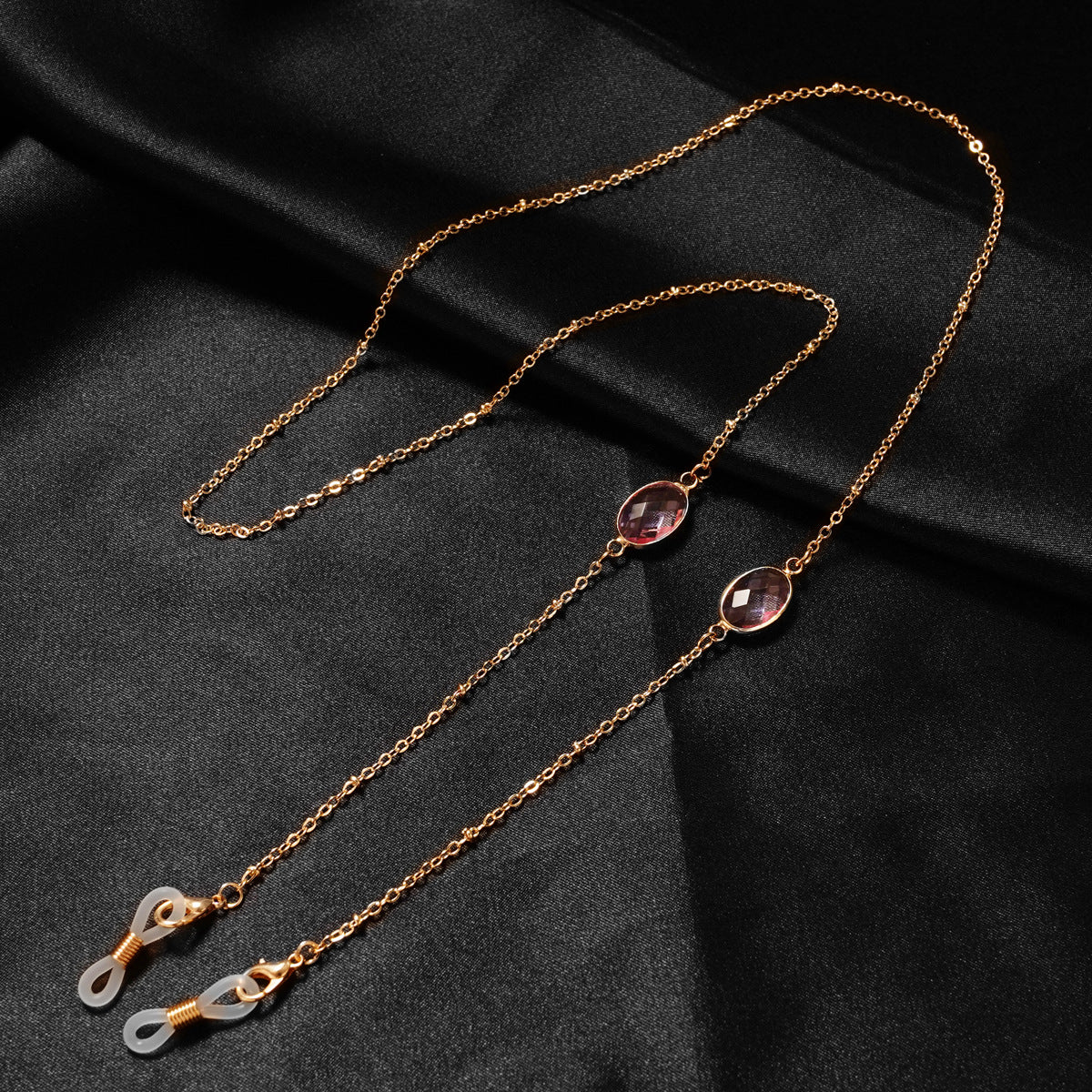 Eleganter mit Edelsteinen verzierter Brillenhalter Brehn
