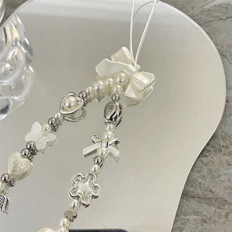 Herz und Schmetterling Charm Perlenarmband Brehn