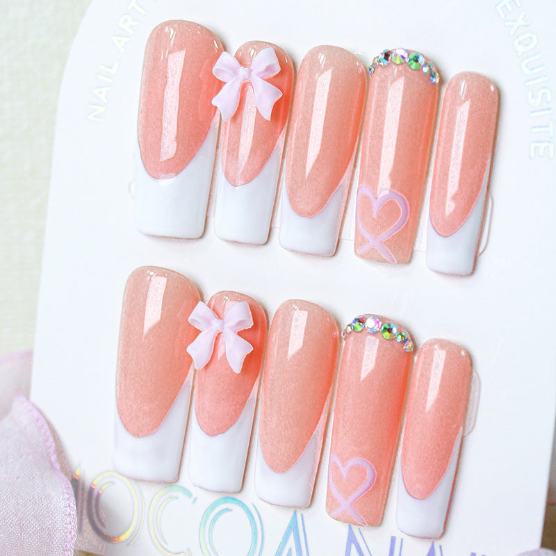 Kunstnagelset mit verspielten Schleifen- und Herzdesigns Brehn