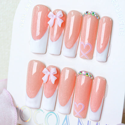Kunstnagelset mit verspielten Schleifen- und Herzdesigns Brehn