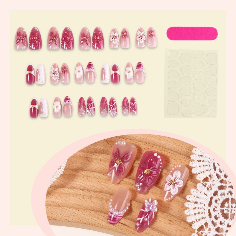 Kreatives Kunstnagelset mit floralen Akzenten und Glitzerverzierungen Brehn