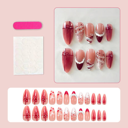 Kunstnagelset mit glamourösen Schleifen und eleganten Perlenverzierungen Brehn
