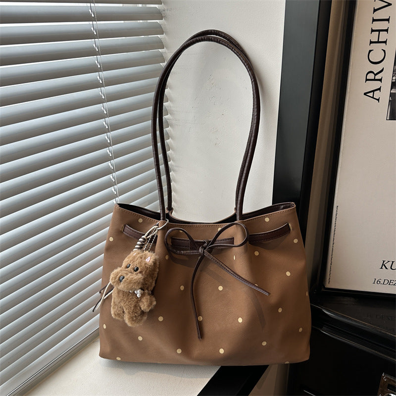 Elegante gepunktete Tragetasche