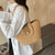 Damen Handtasche aus geflochtenem Naturmaterial mit elegantem Verschluss Brehn