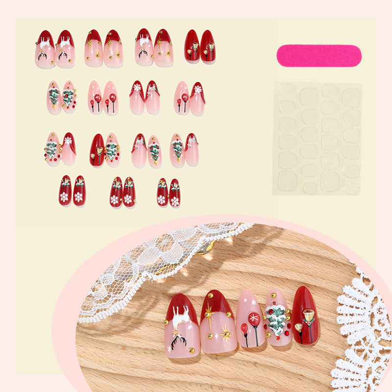Kunstnagelset mit festlichen Weihnachtsmotiven und funkelnden Akzenten Brehn