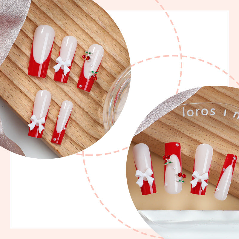 Kreatives Nagelset mit festlichen Kirschmotiven Brehn