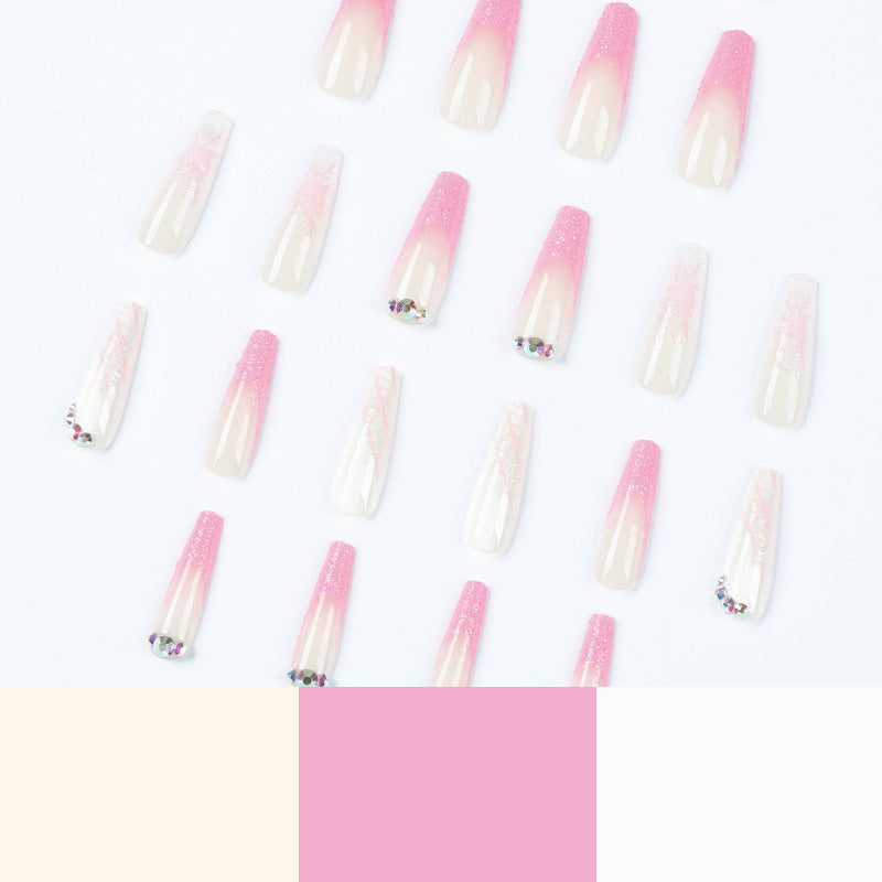 Kunstvolle Stiletto-Nägel mit Glitzer- und Schneeflockendesign Brehn