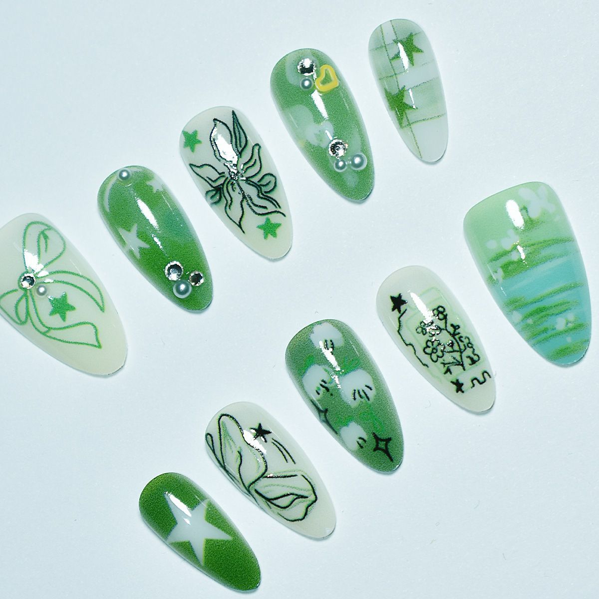 Künstlerische grüne Nagelverbesserungen Brehn