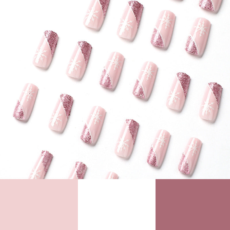 Kunstvolle Nagelverlängerungen mit festlichem Glitzer und Schneeflockendesign Brehn