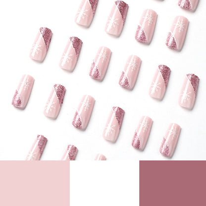 Kunstvolle Nagelverlängerungen mit festlichem Glitzer und Schneeflockendesign Brehn