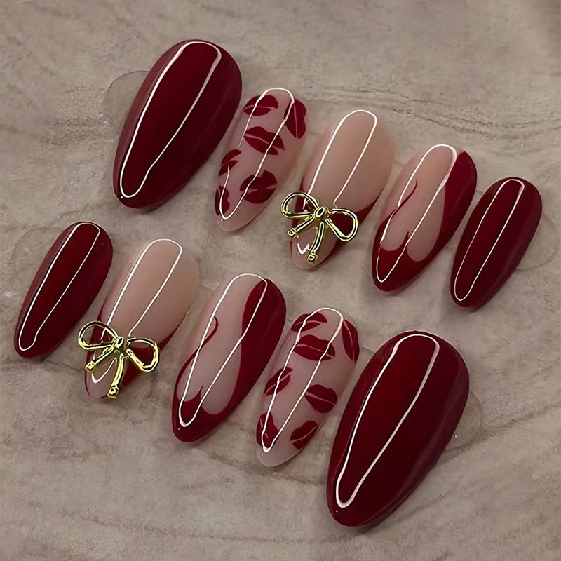 Kunstnagelset mit eleganten Schleifen- und Kussmund-Designs Brehn