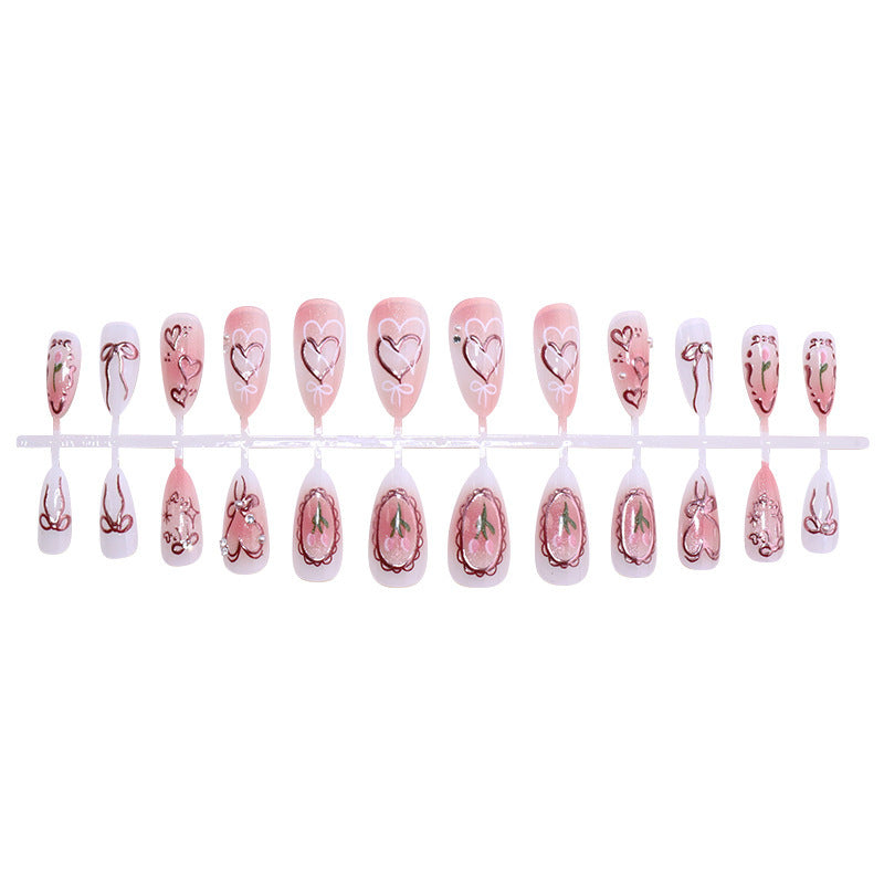 Kunstnagelset mit romantischen Herzen und Schleifen-Design Brehn