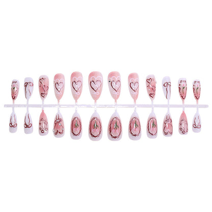 Kunstnagelset mit romantischen Herzen und Schleifen-Design Brehn